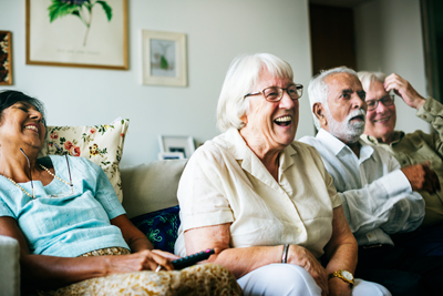 Group of seniors watching television