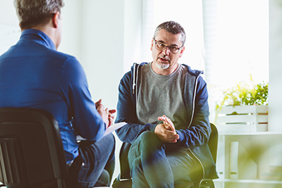 Patient talking with mental health professional.